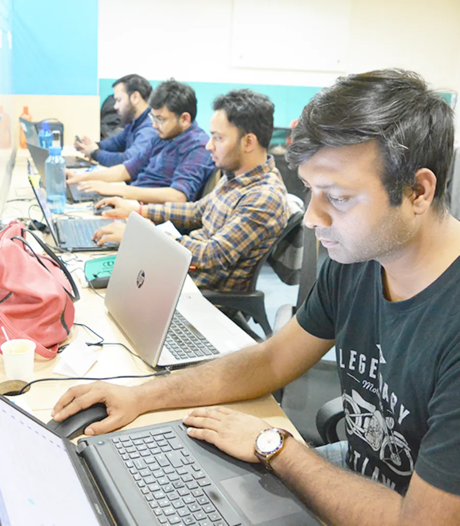 Webkul engineers building on laptops